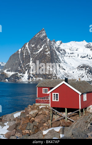 Traditional red wooden Rorbu fishermen`s huts in village of Hamnoy on Moskenesoya Island in Lofoten Islands in Norway Stock Photo